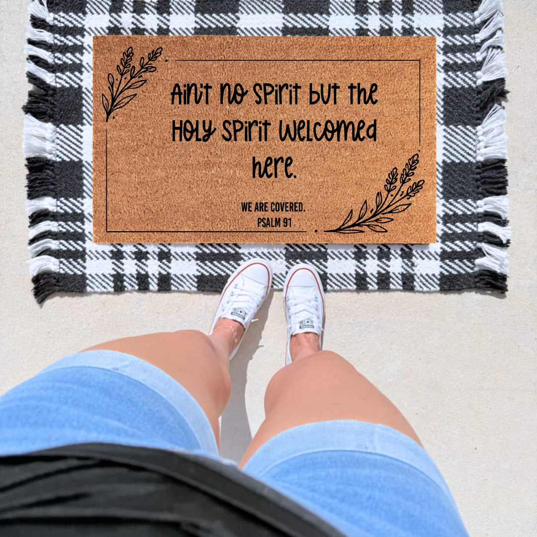 Christian Holy Spirit welcome doormat featuring a faith-inspired message, Psalm 91, and botanical accents on a natural coir mat for front porch décor.
