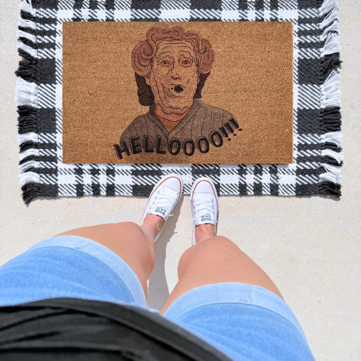 Funny Mrs. Doubtfire inspired coir doormat featuring the iconic "Hellooo!!!" quote and character illustration on a natural coir welcome mat for movie lovers.